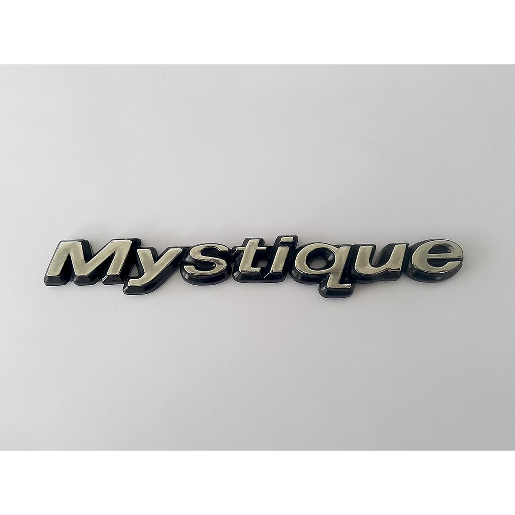 INSIGNIA ORIGINAL FORD MYSTIQUE LETRAS TRAS ( F-164)