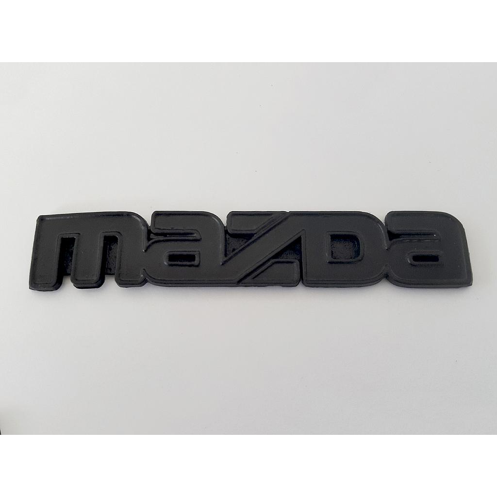 INSIGNIA ORIGINAL MAZDA PU DE 1985 AL 1988 LETRAS LAT ( M-002)