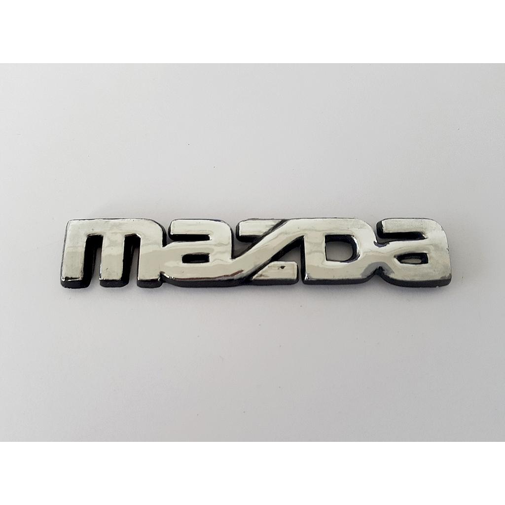 INSIGNIA ORIGINAL MAZDA SEDAN DE 1987 AL 1989 LETRAS LAT ( M-003)
