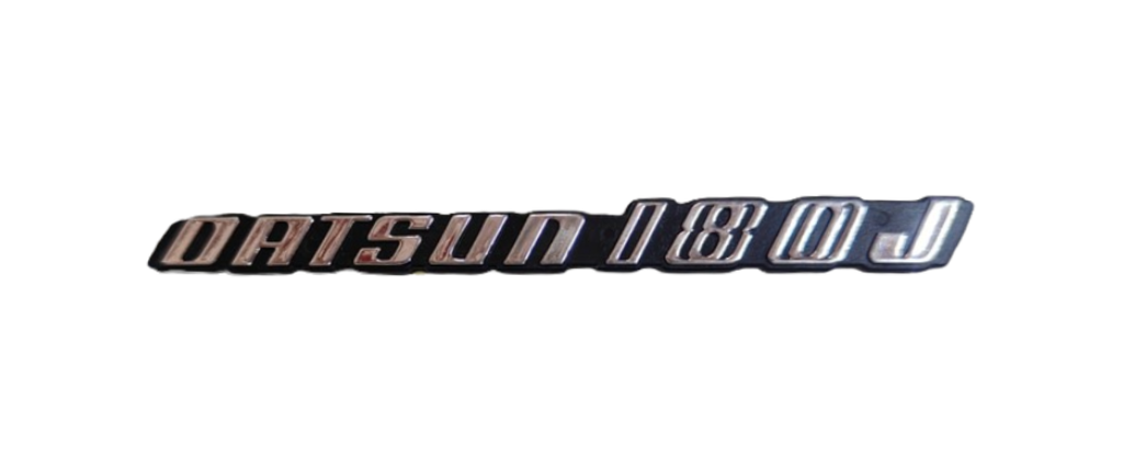 [DA18JNISINLEL] INSIGNIA ORIGINAL NISSAN DATSUN 180J LETRAS LAT ( DA18NISINLEL)