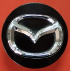 [DODUR04TAPRHCE] TAPON CENTRO RIN MAZDA VARIOS MODELOS NEGRO CON CROMO 57 MM DESMONTADO ORIGINAL 1 PZA